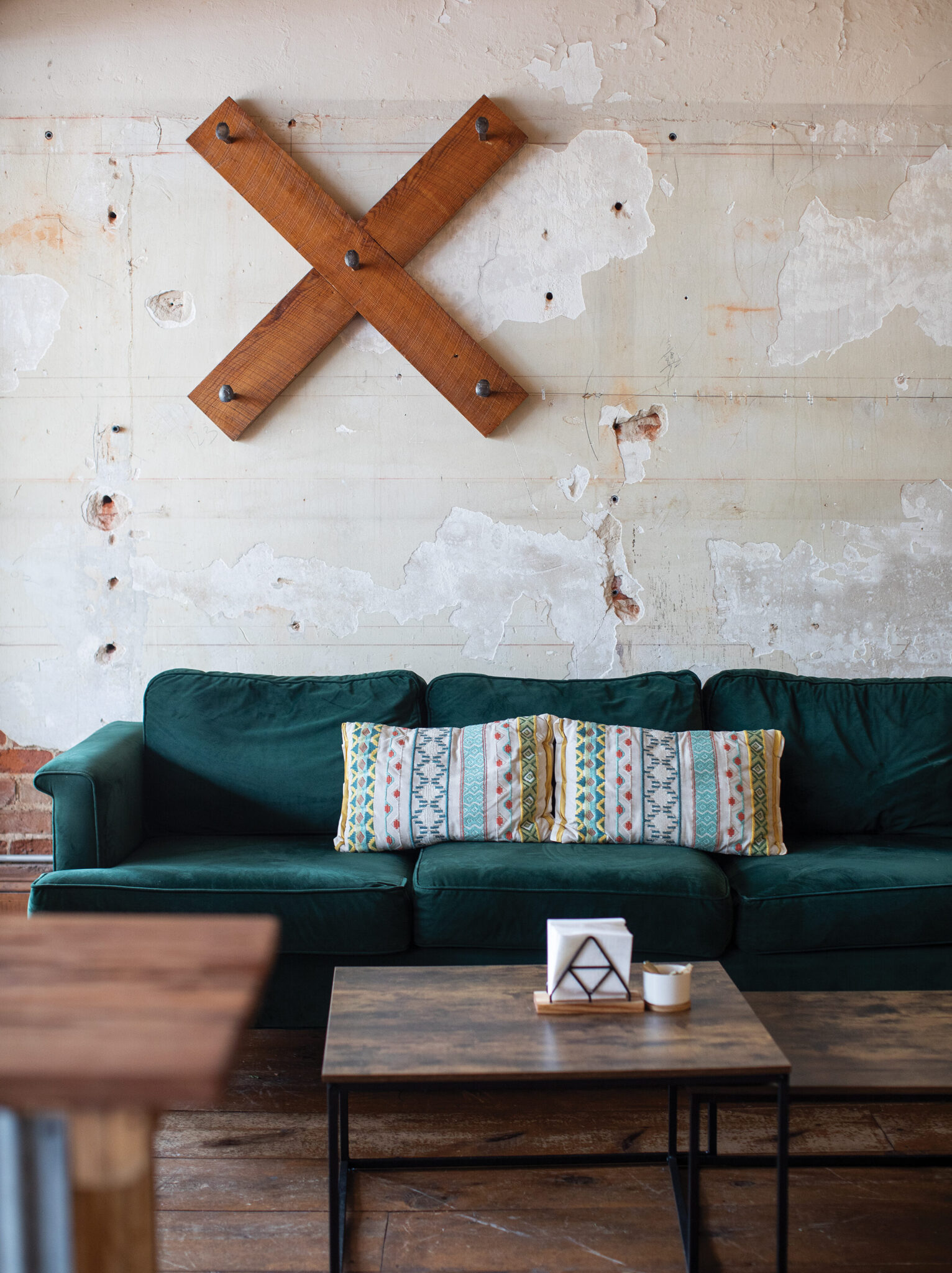 The teal sofa corner inside The Local